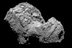 3200 Phaethon Rock Comet surface close-up showing rugged, rocky terrain with deep shadows and fractured features against a black background.